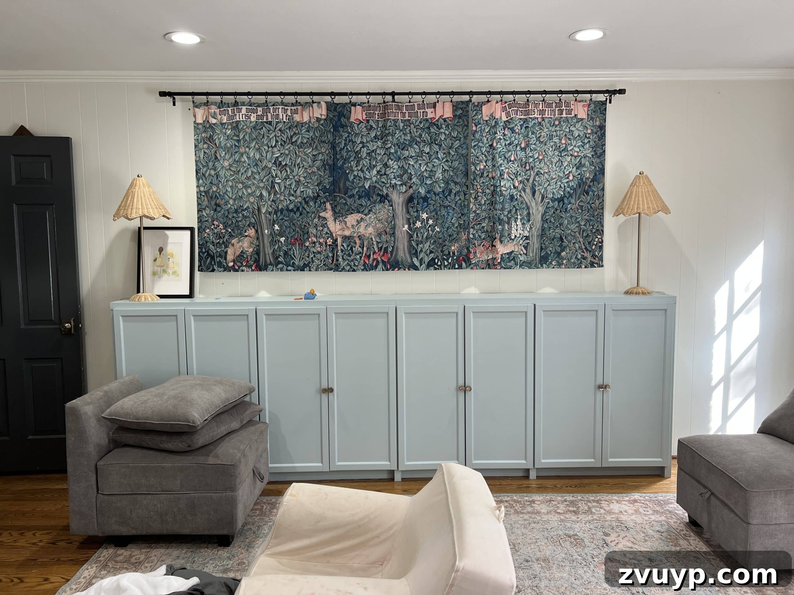 Your Next Media Room Makeover: Smart Storage for a Clutter-Free Entertainment Hub 3 Another 'before' view of the playroom, showing a child's chair with marker scribbles, emphasizing the transition from a kid-focused space to a media room.