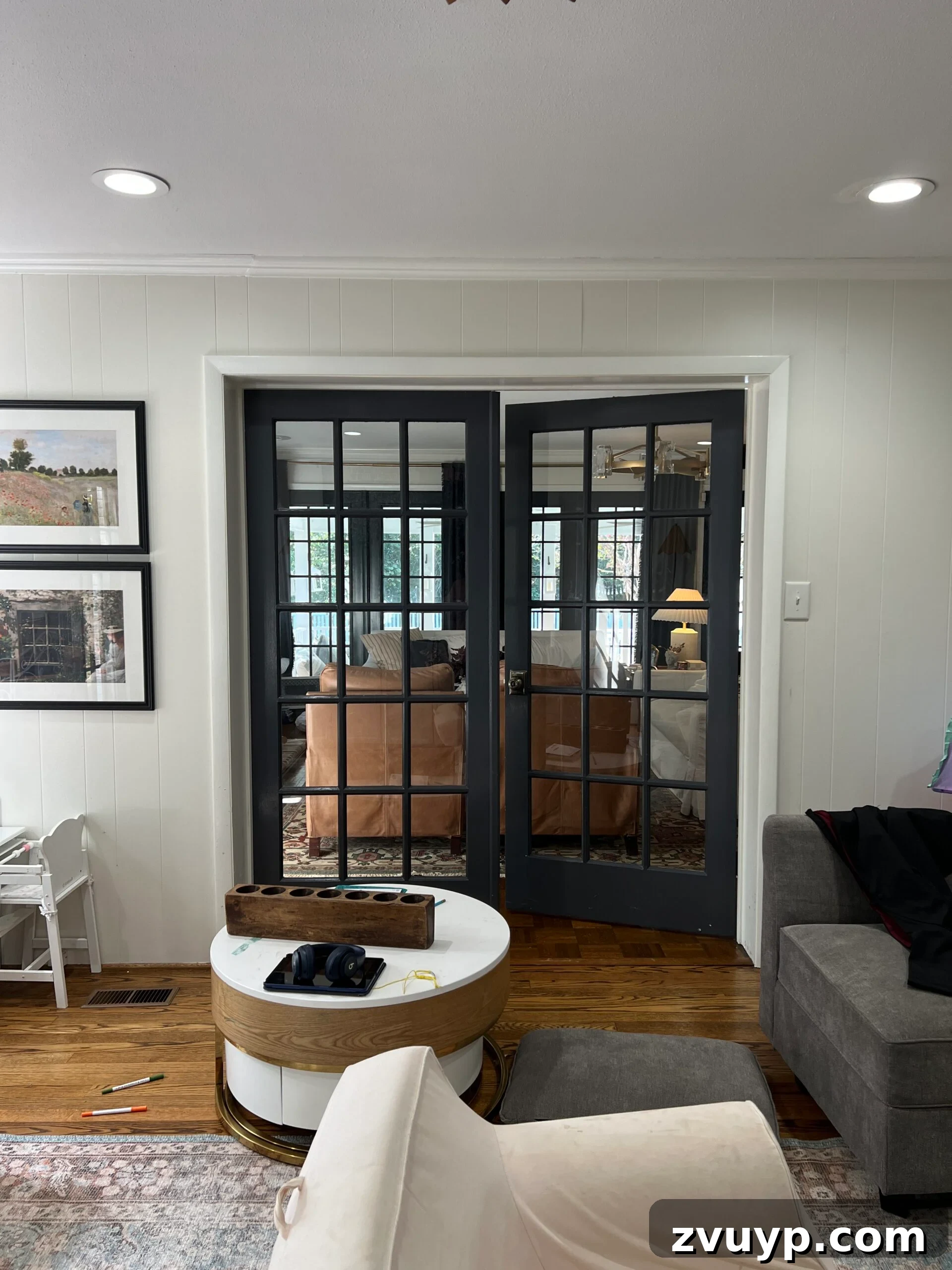Your Next Media Room Makeover: Smart Storage for a Clutter-Free Entertainment Hub 6 Before photo of double French doors in a playroom, highlighting the potential for integrating built-in storage around the doorway for a media room transformation.