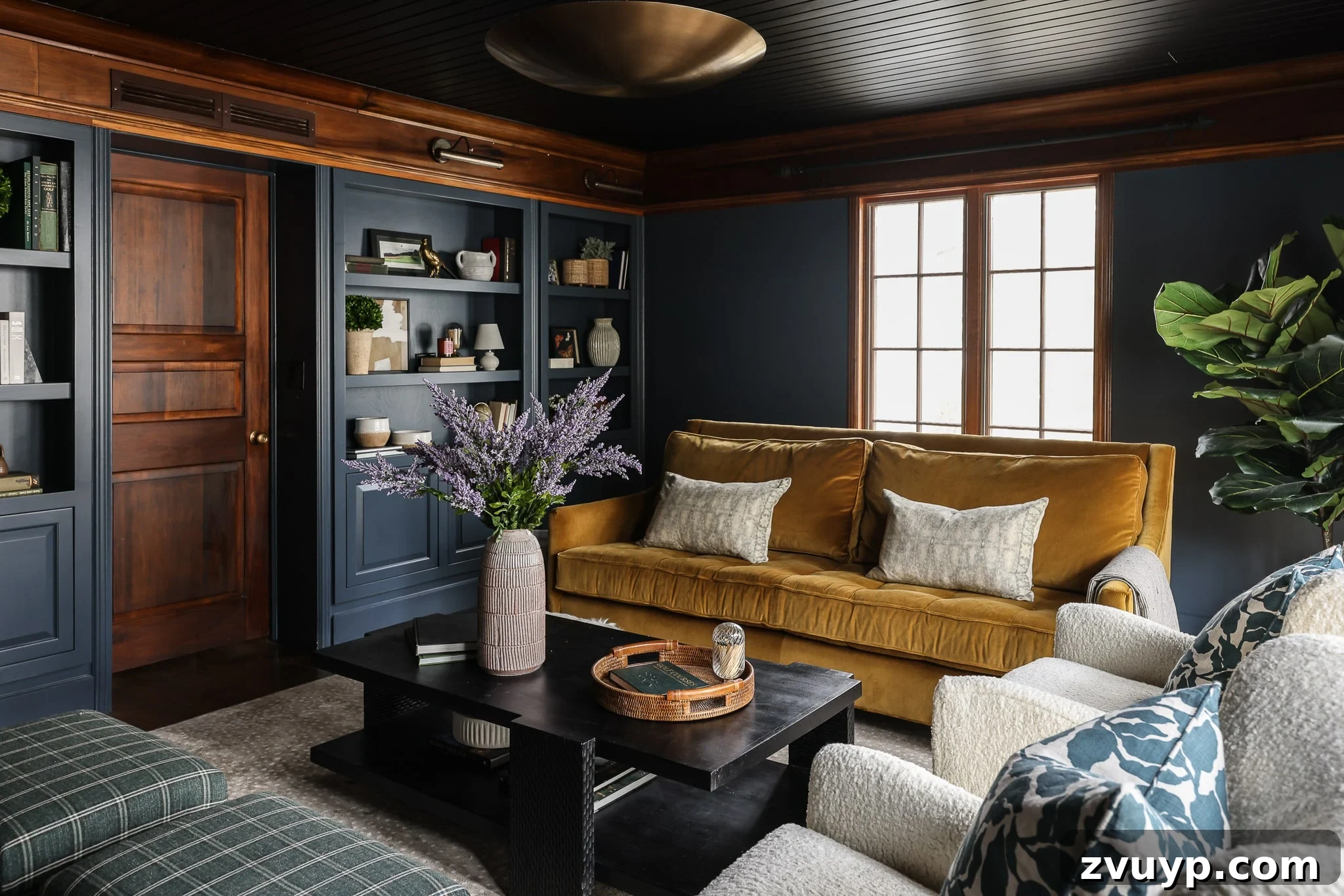 Your Next Media Room Makeover: Smart Storage for a Clutter-Free Entertainment Hub 9 A beautifully designed media room showcasing custom built-in shelves gracefully surrounding a closed doorway, creating a cohesive and highly functional wall unit with ample storage and display space.
