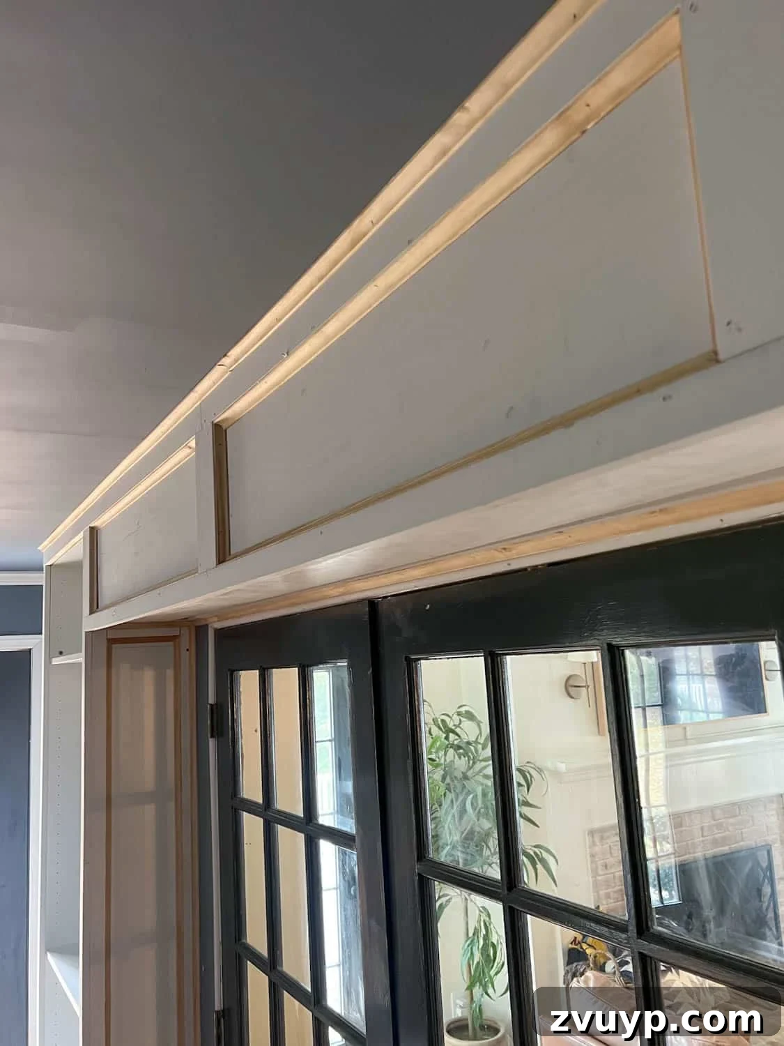 The Ultimate Hidden Projector Screen IKEA Hack 12 Built-in box between bookcases with the front panel attached, completely concealing the projector screen