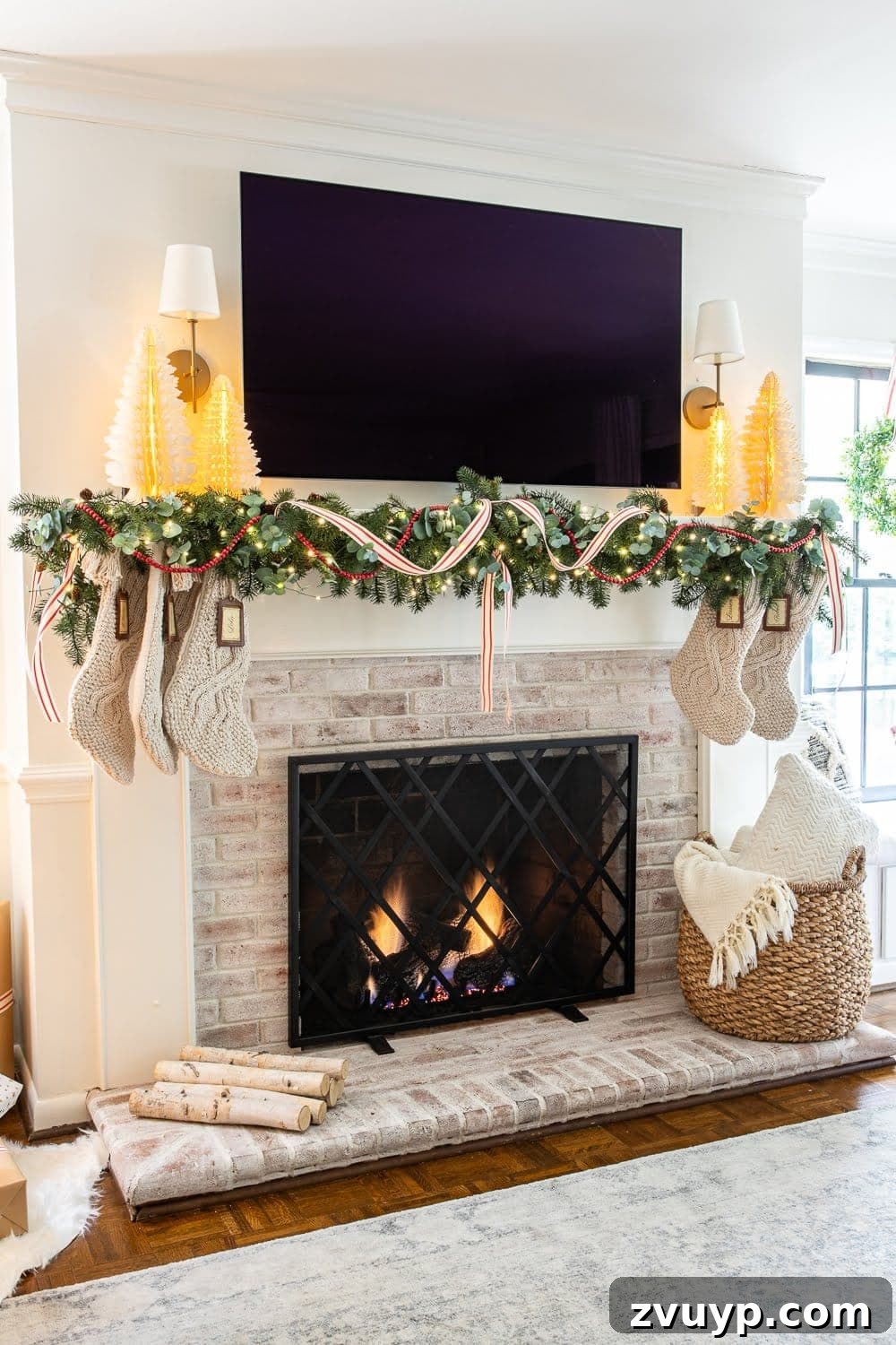Craft Your Own Stunning Christmas Mantel Garland 22 Christmas mantel beautifully decorated with a eucalyptus pine garland, soft red unwired ribbon, and a cranberry strand, exuding traditional charm.