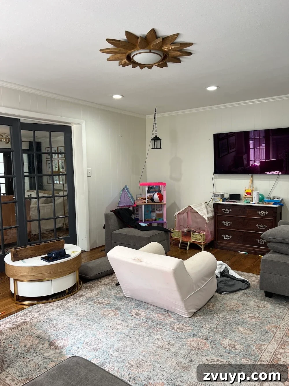 Affordable DIY Media Room Transformation 16 Before photo of the playroom corner, showing potential space for the future desk and gallery wall