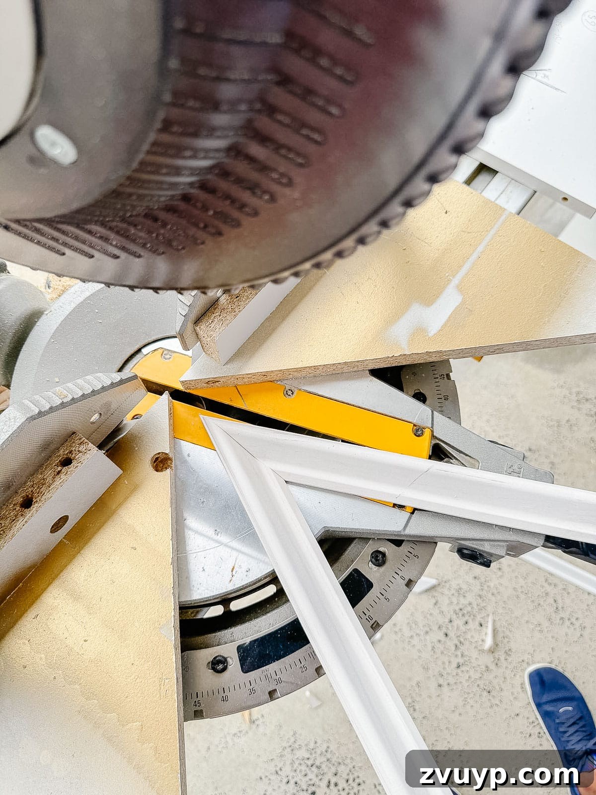 Transform Your Stairs: Effortless DIY Wainscoting Guide 11 Precise angled molding cuts on a miter saw for stair wainscoting