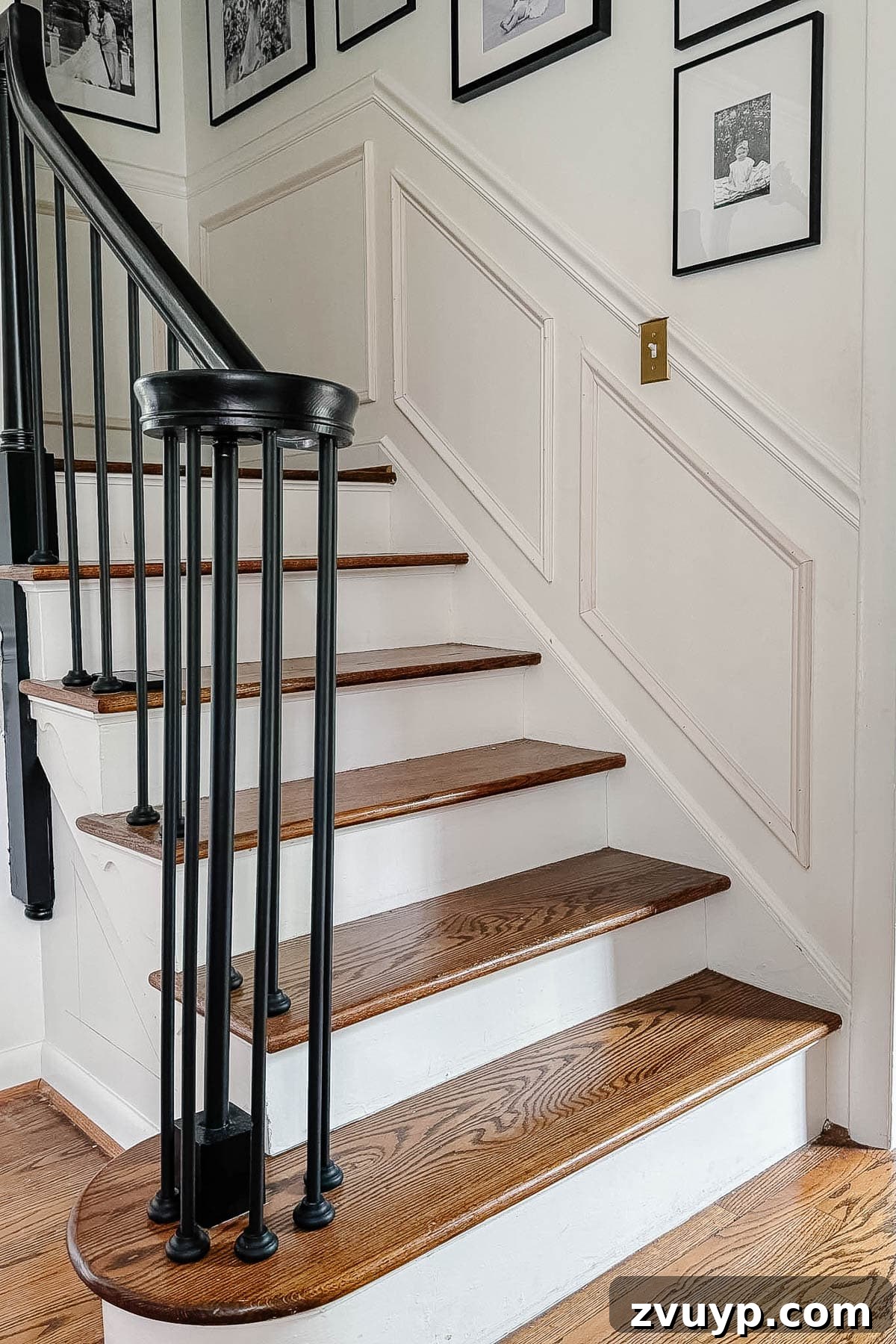 Transform Your Stairs: Effortless DIY Wainscoting Guide 15 Finished picture frame molding stair wainscoting before final paint