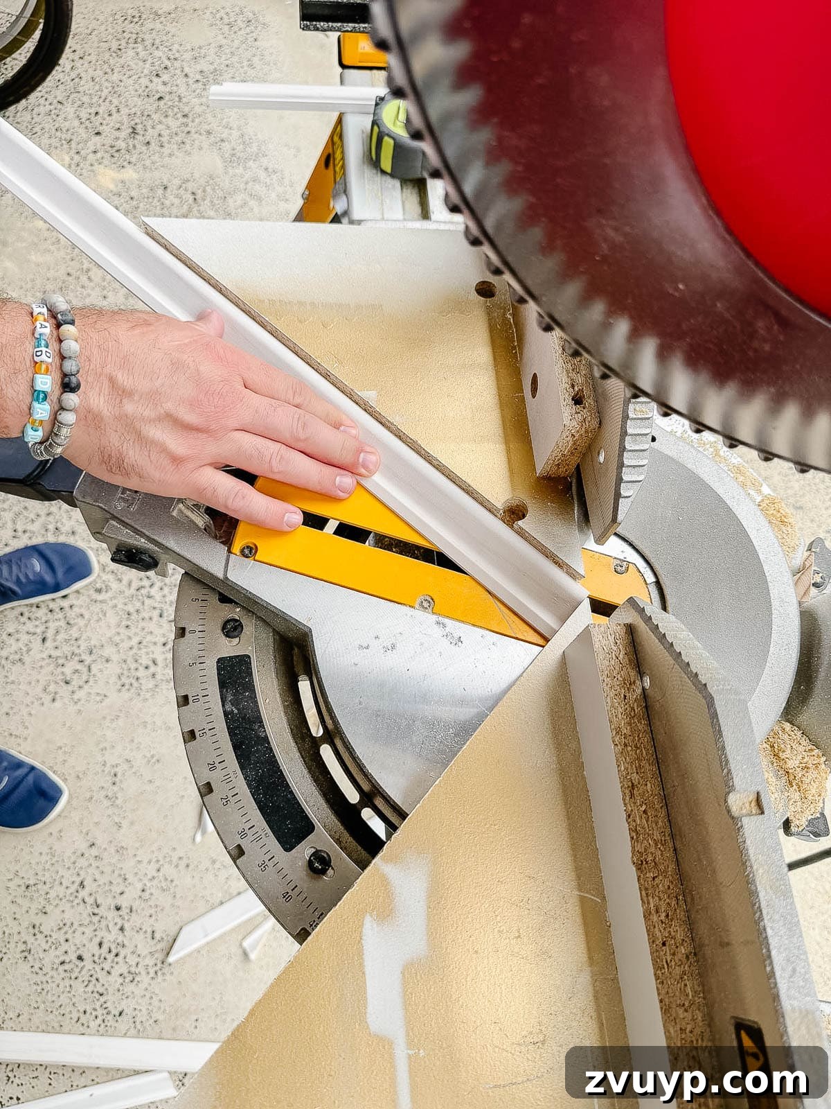 Transform Your Stairs: Effortless DIY Wainscoting Guide 9 DIY angle cutting guide on a miter saw for wainscoting installation