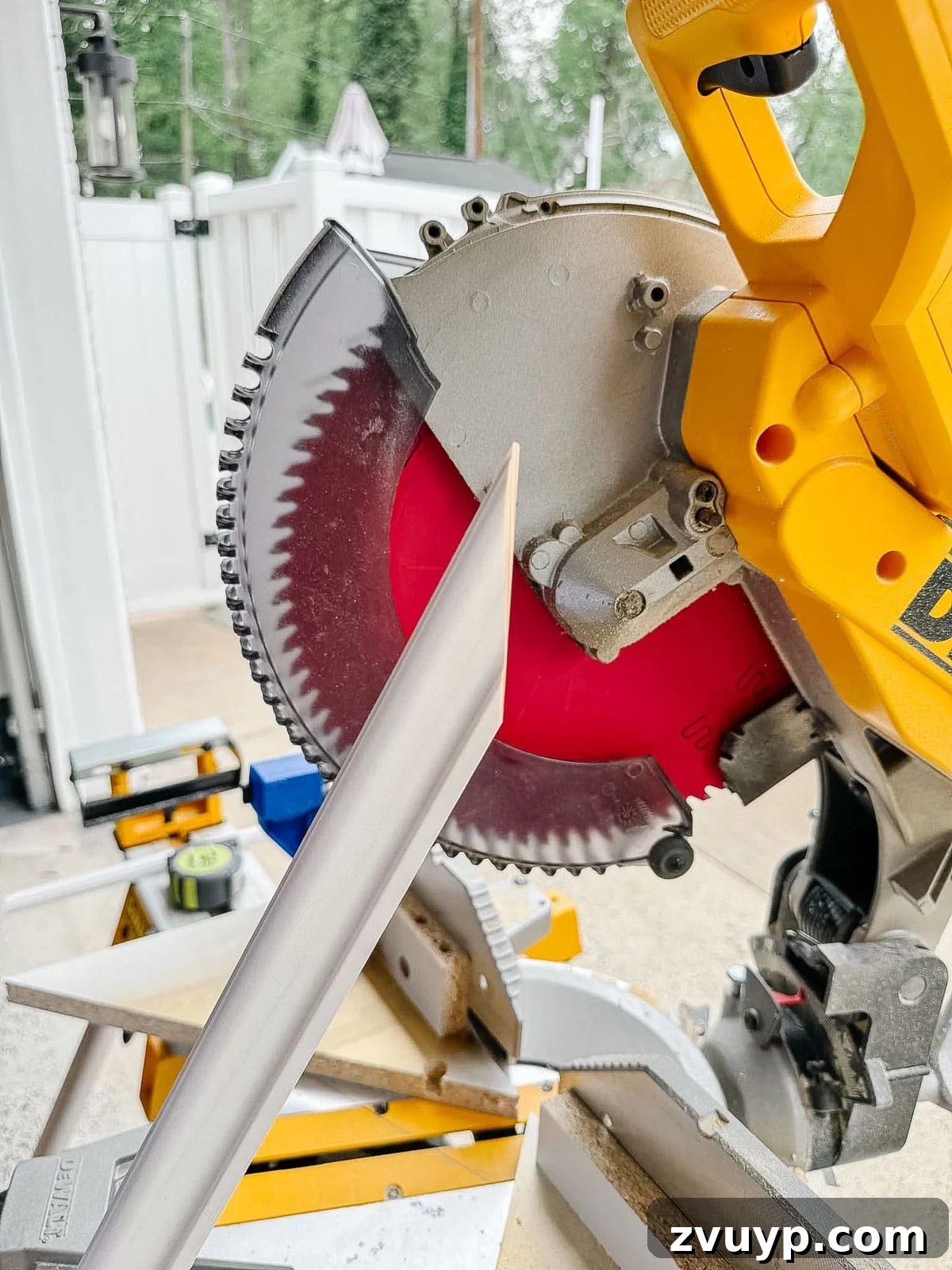 Transform Your Stairs: Effortless DIY Wainscoting Guide 10 Cutting angles on trim molding using a miter saw for stair wainscoting