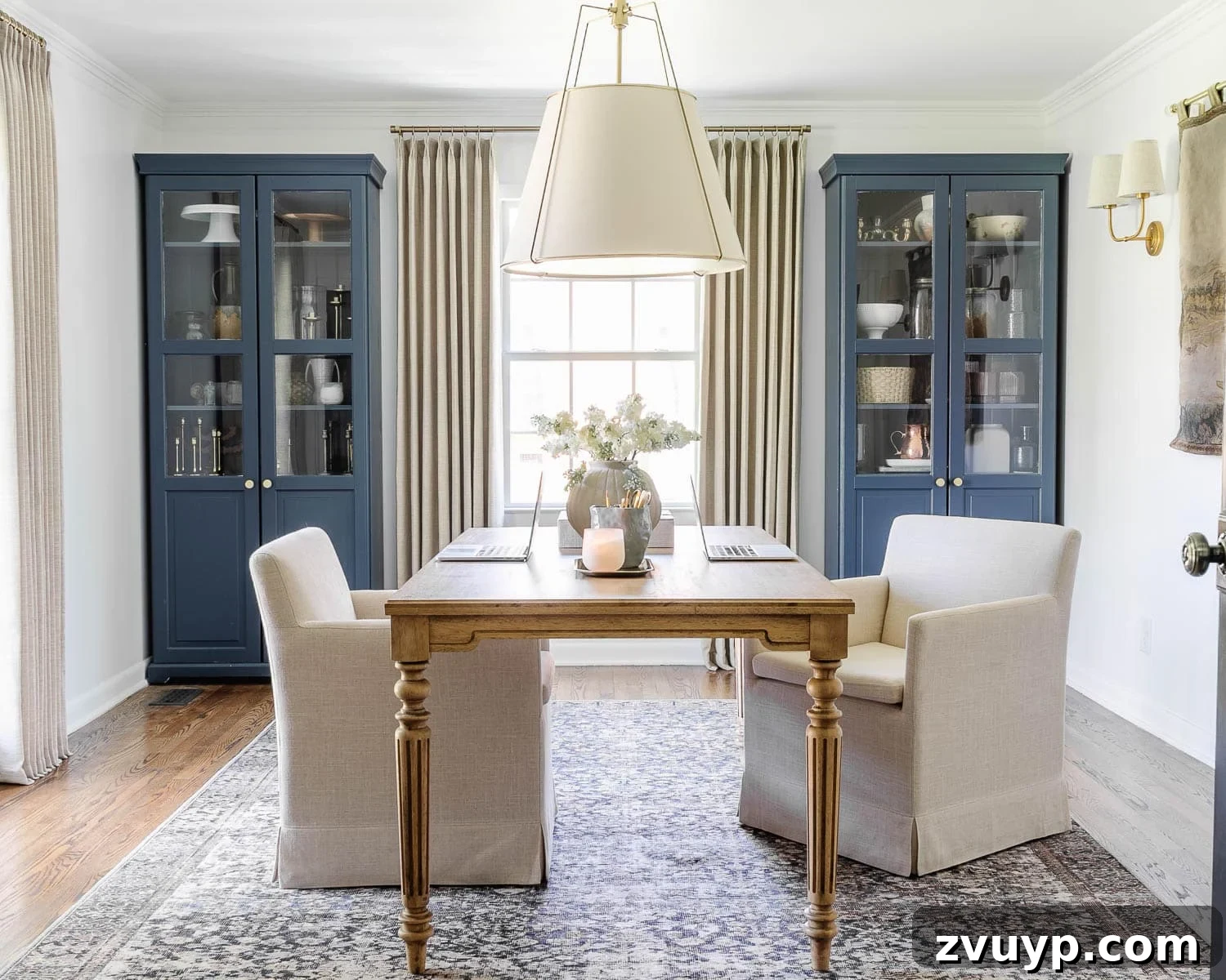 Power Up Your Productivity: Smart Home Office Layouts 2 Inviting home office for two featuring a spacious work table, set up for enhanced productivity.