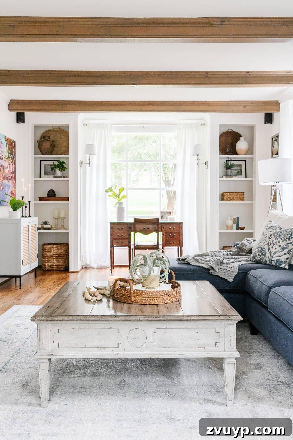 Power Up Your Productivity: Smart Home Office Layouts 15 A beautifully transformed modern coastal living room, functioning as a dual-purpose office and relaxation space.