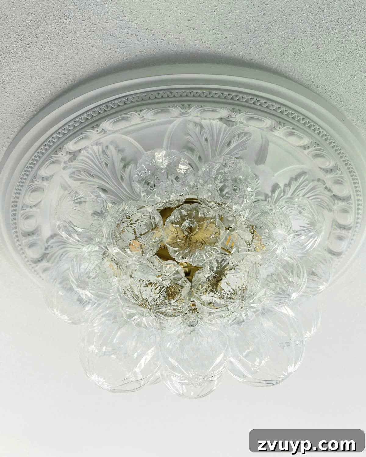 Power Up Your Productivity: Smart Home Office Layouts 10 A modern bubble light fixture illuminating the home office, providing balanced and inviting overhead light.