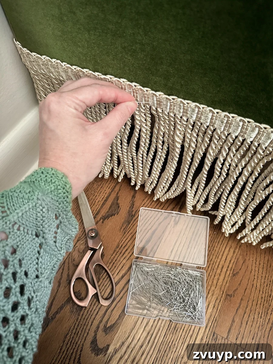 Instant Chic: DIY Fringe Trim for Your Seating 5 adding fringe trim to a sofa with straight pins for easy removal