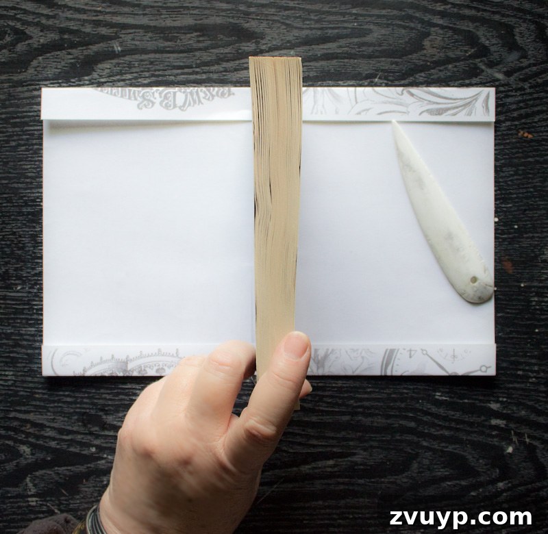 Creasing paper - Centering the book on the prepared paper before wrapping