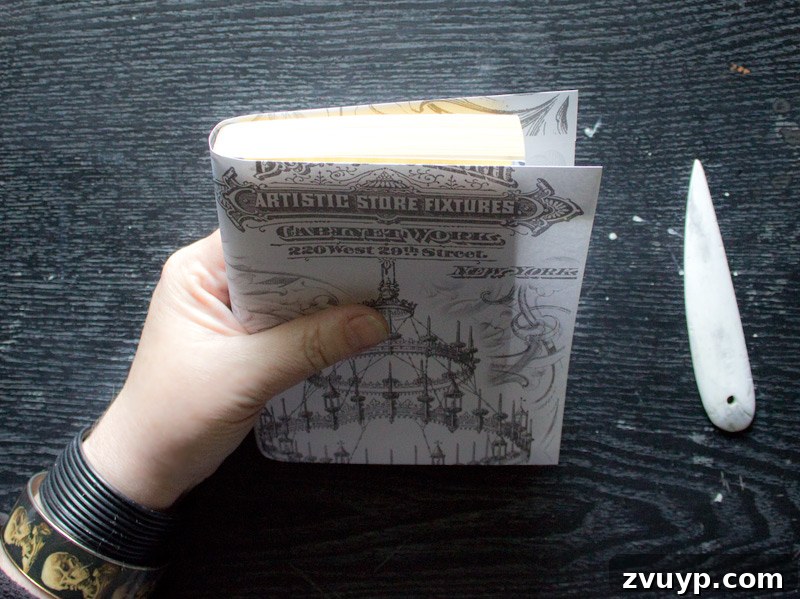 Covering book - Wrapping the paper around the book, aiming for even overlap