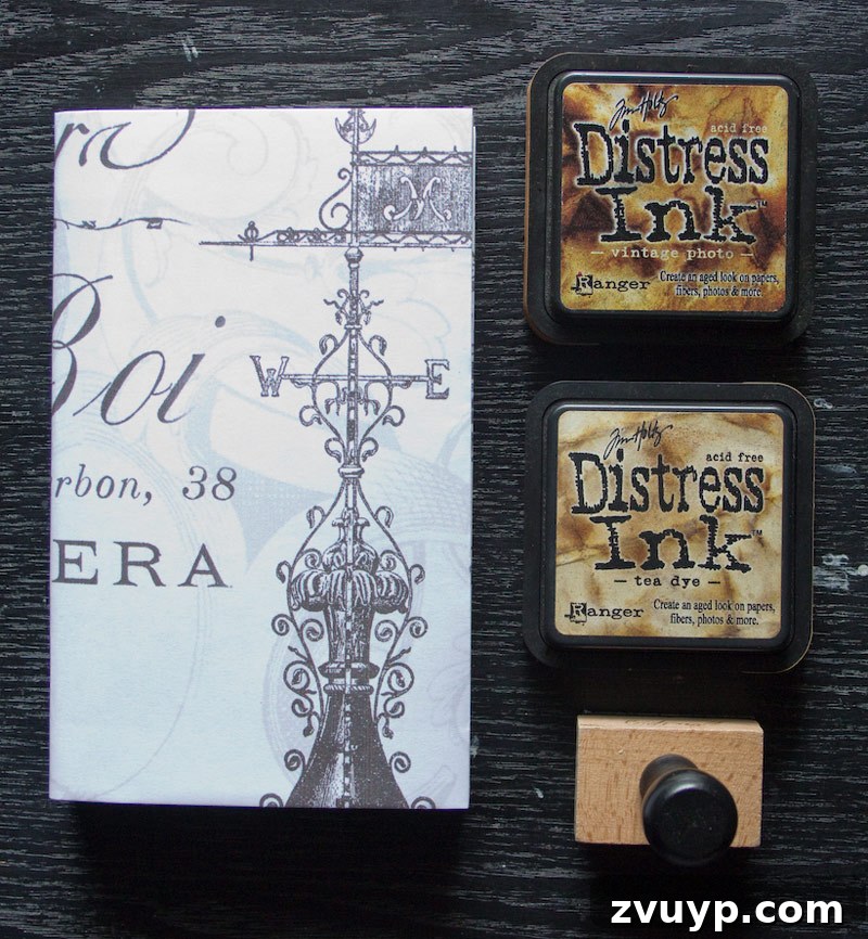 Distress ink - Preparing to apply distress ink to the book cover