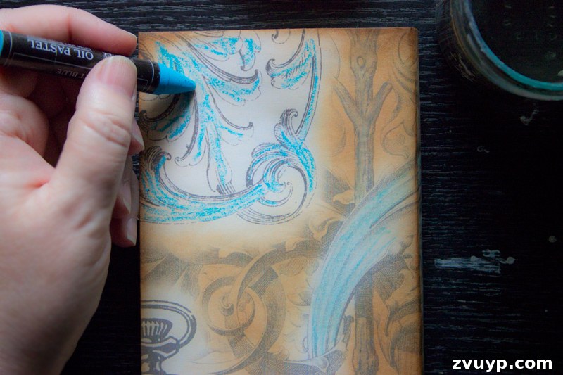 Coloring in free printable Journal covers - Applying oil pastels in broad strokes