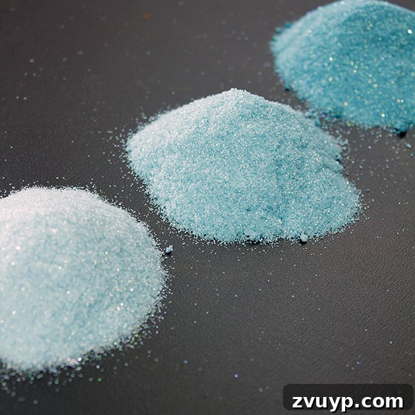 Three different shades of custom colored glitter, showing light, medium, and dark tones achieved by varying ink drops.