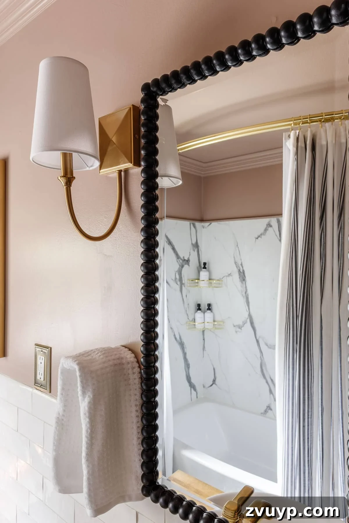 Four-Day Flip: Our Bathroom's Bold Black & Pink Reveal 11 pink bathroom walls with black beaded mirrors and gold sconces
