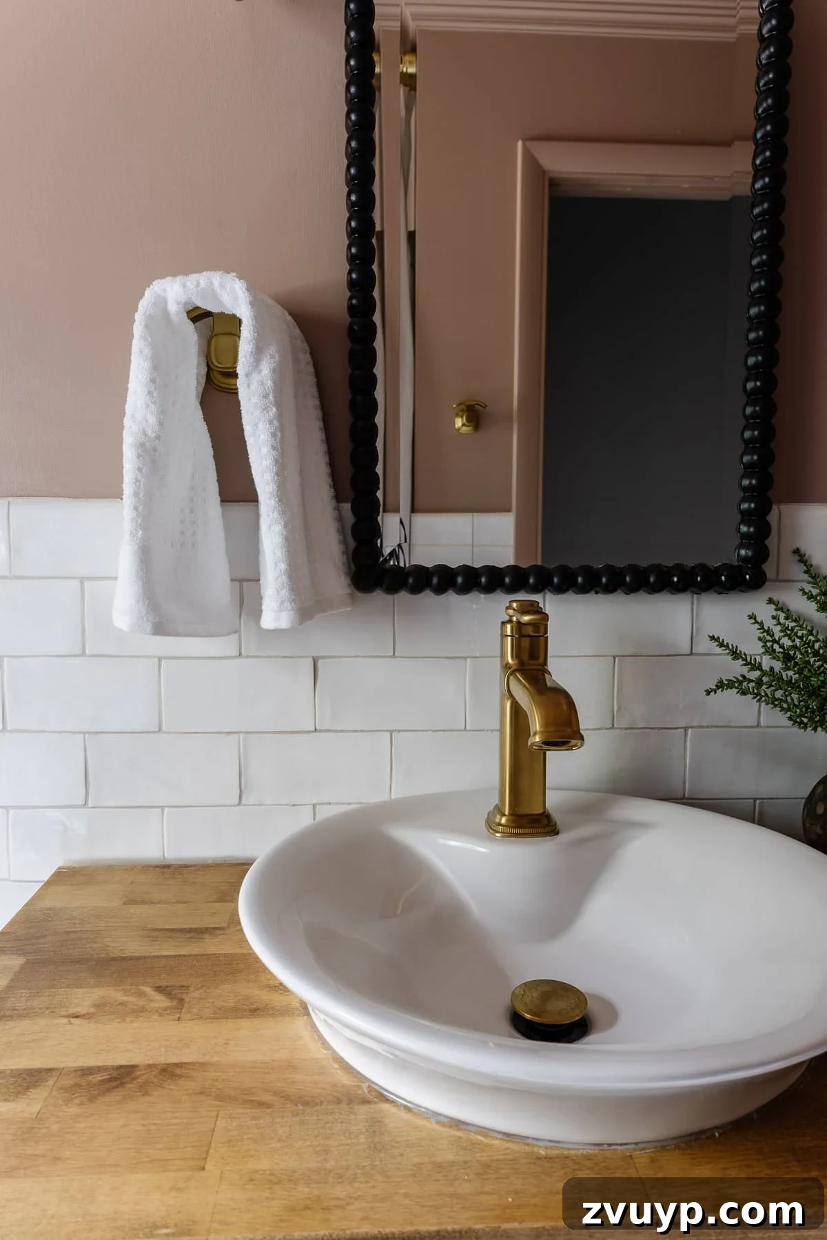 Four-Day Flip: Our Bathroom's Bold Black & Pink Reveal 10 Behr Postmodern Mauve pink bathroom with subway tile and black beaded mirror