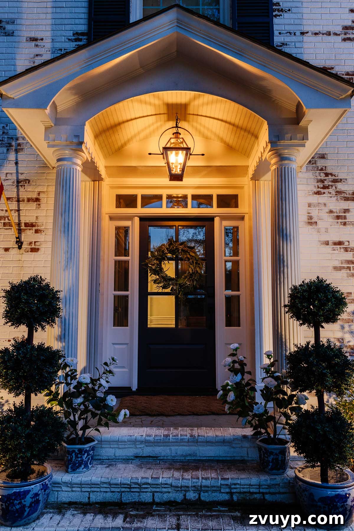 The Ultimate Flame Bulbs for a Vintage Gas Lamp Vibe 11 fake gas lantern on a front porch with flickering flame light bulbs at night