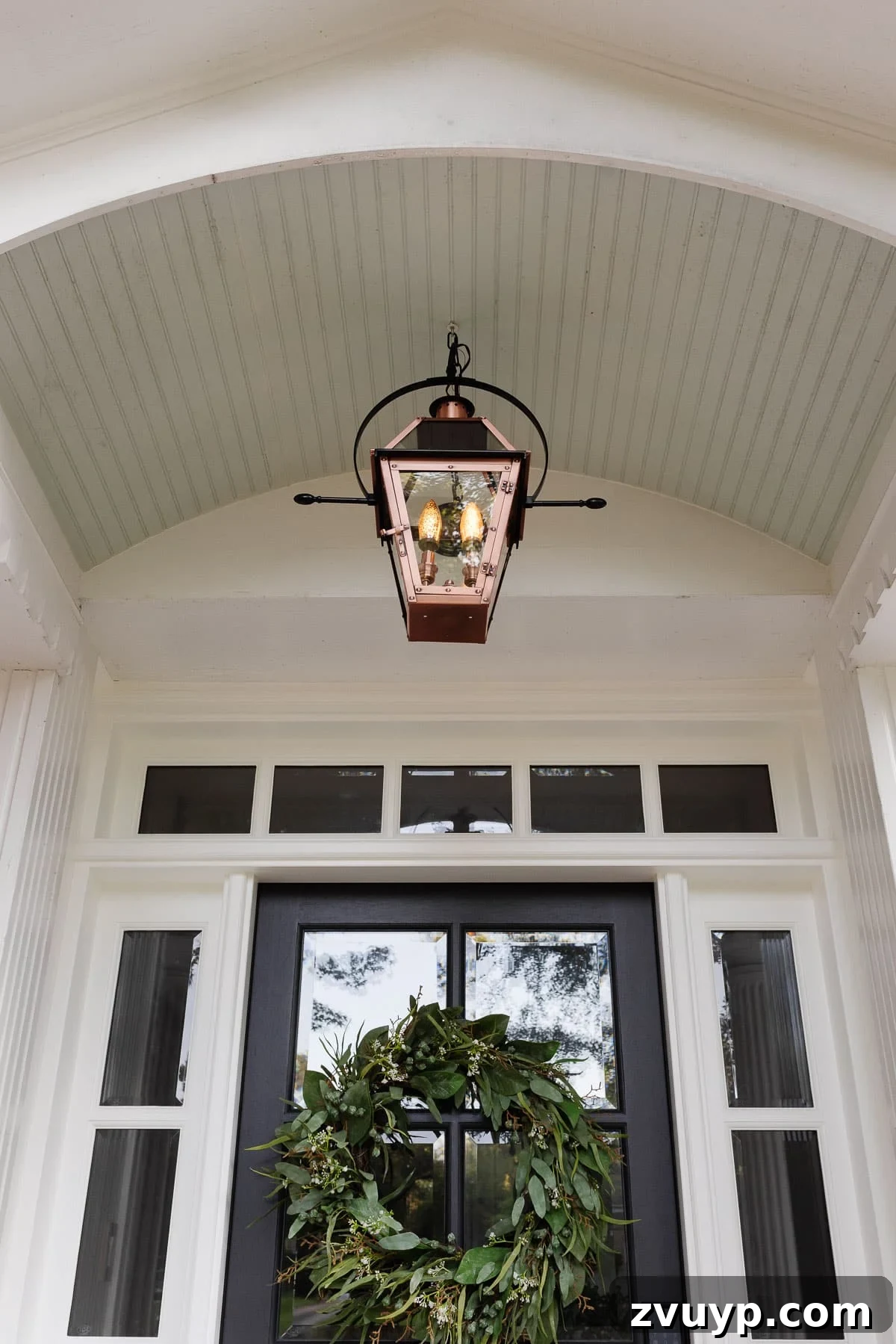The Ultimate Flame Bulbs for a Vintage Gas Lamp Vibe 3 flickering flame light bulb in a lantern on a front porch
