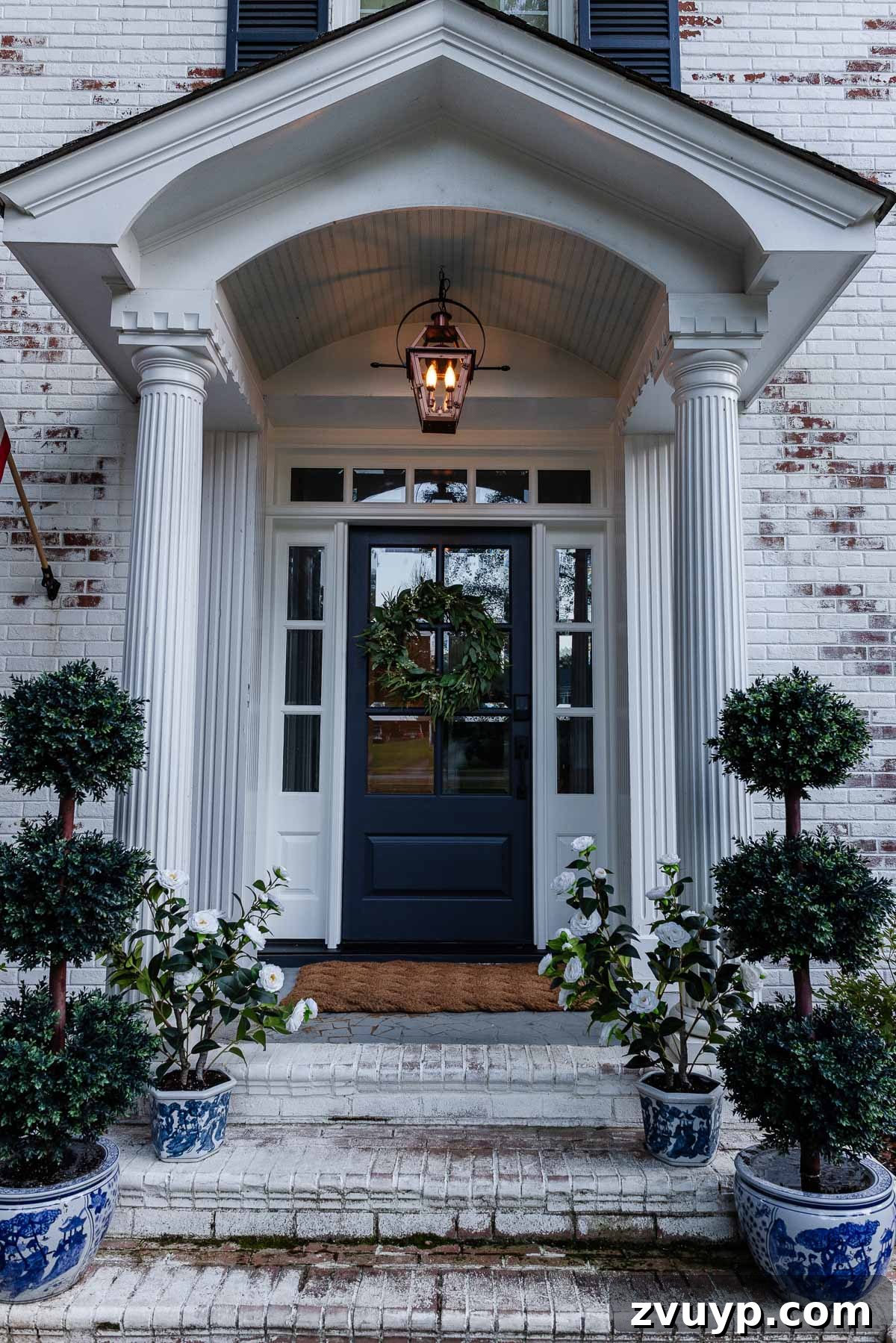 The Ultimate Flame Bulbs for a Vintage Gas Lamp Vibe 10 fake gas lantern on a front porch with flickering flame light bulbs at dusk
