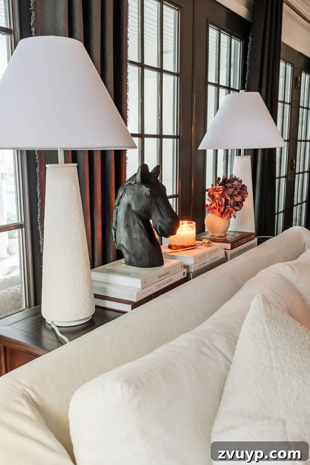The Sofa Table Blunder Behind Your Couch 6 sofa table decor ideas behind a sofa using lamps, books, and candles