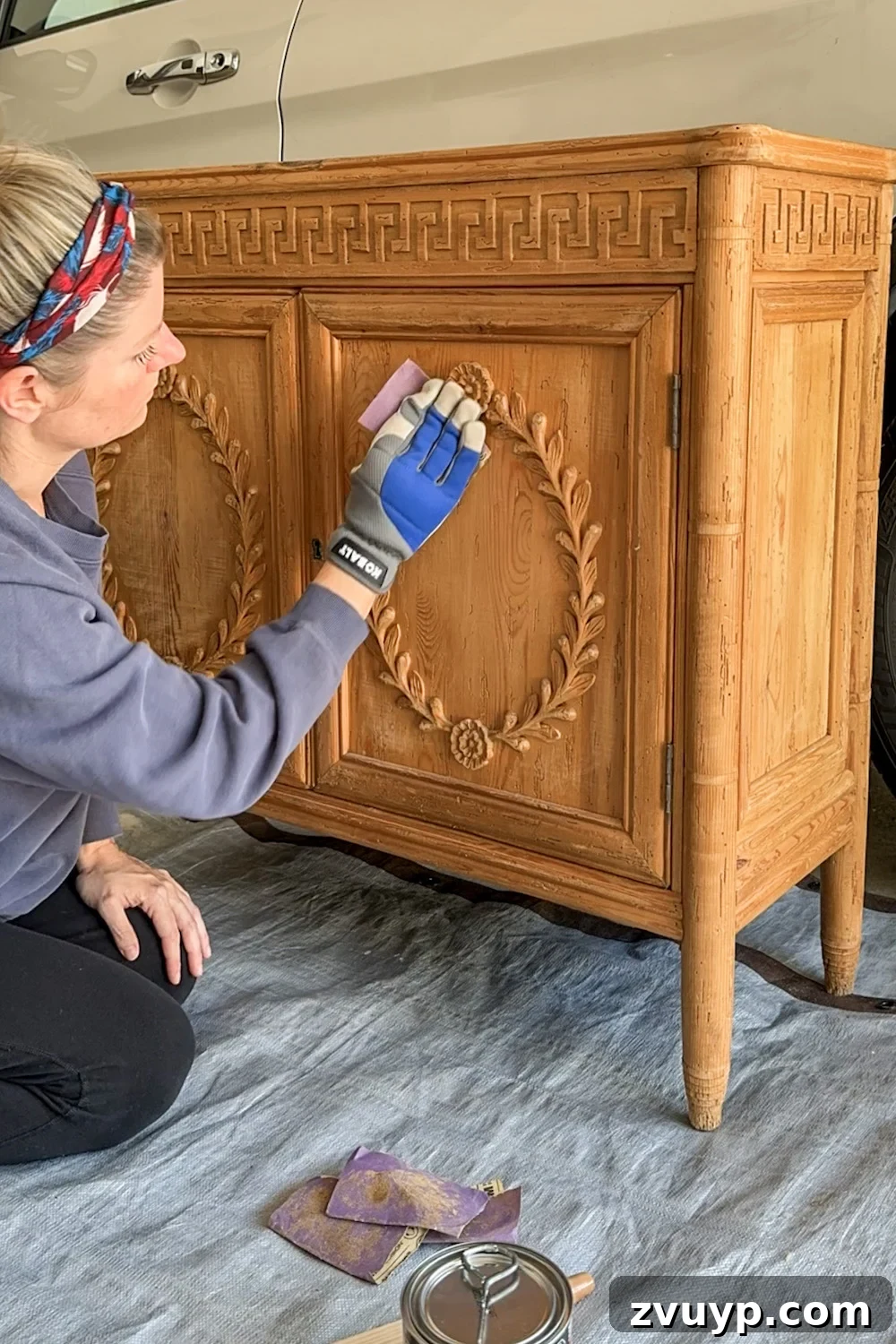 No-Sand Furniture Transformation: Stain Over Stain 5 Sanding wood cabinet for gel stain application, showing the light scuffing process