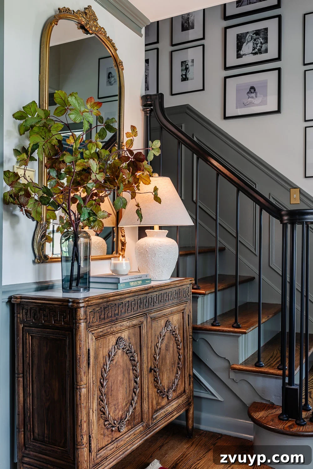 High Impact Foyer Decor for Under 300 7 foyer decorating ideas with credenza styled with lamp, vase of stems, books, and candle