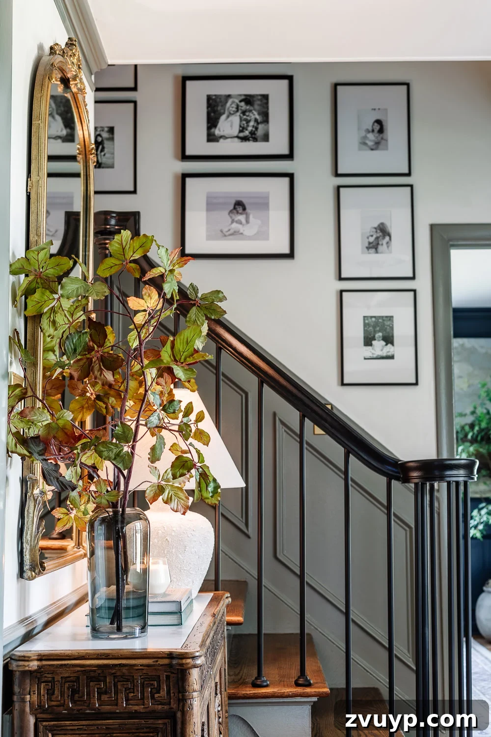 High Impact Foyer Decor for Under 300 9 vase of tall fall stems on entryway table credenza and family gallery wall on staircase