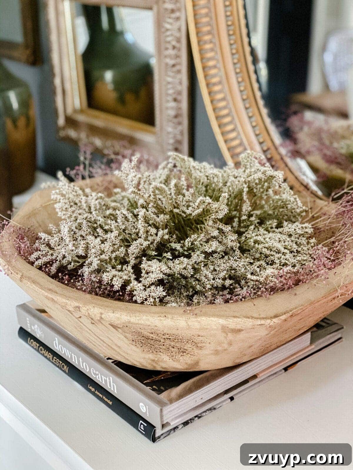 Wooden bowl of dried flowers for natural decor display, adding rustic beauty.