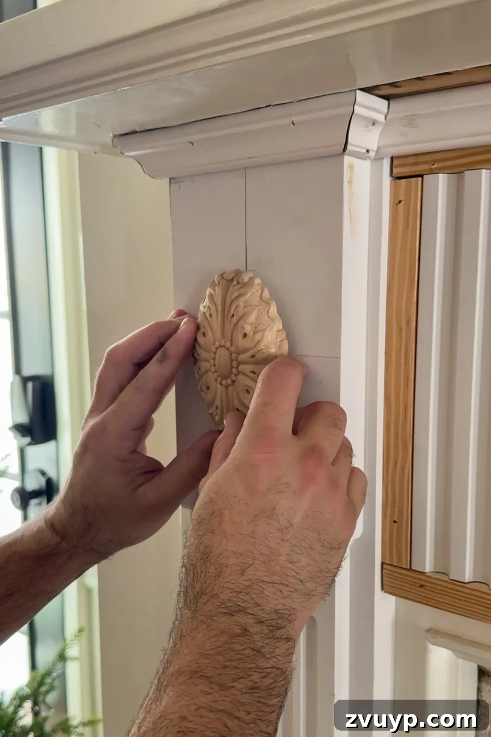 Achieve Timeless Elegance DIY Fireplace Molding Makeover 15 adding rosette overlay molding to fireplace