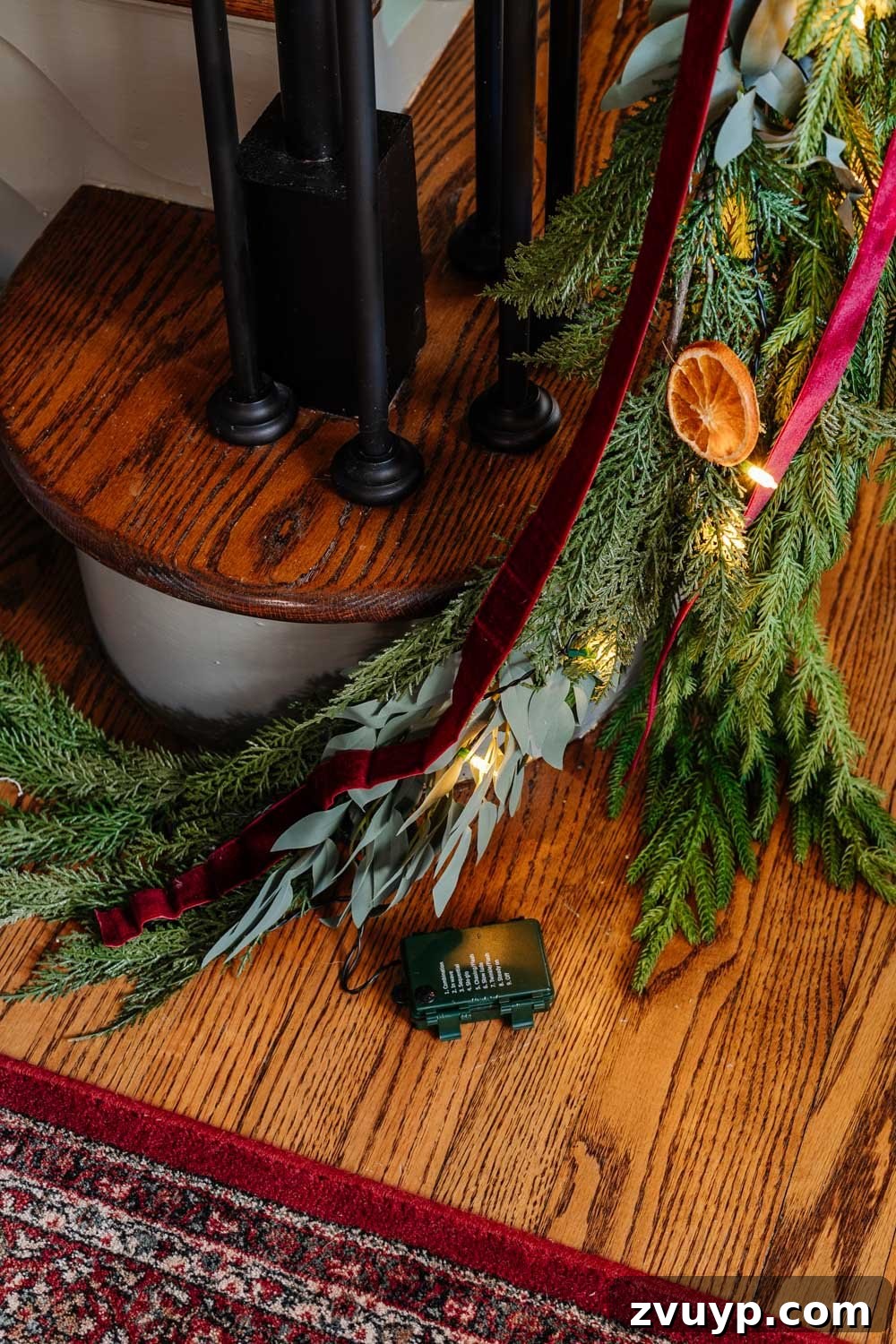 Old-World Christmas Entryway Charm 7 hiding battery pack of twinkle lights in garland