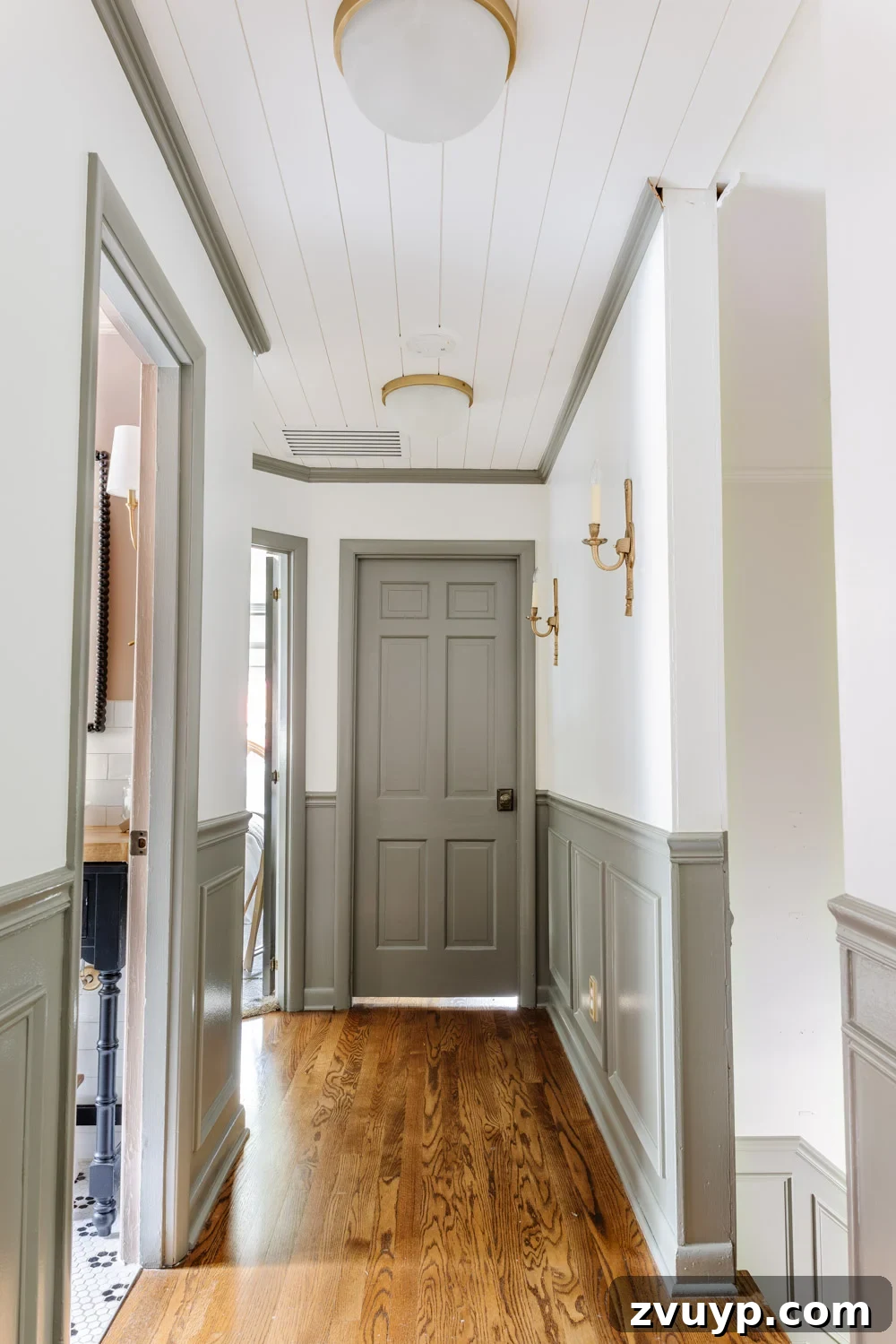 painted doors and wainscoting in a hallway with Sherwin Williams Willowleaf