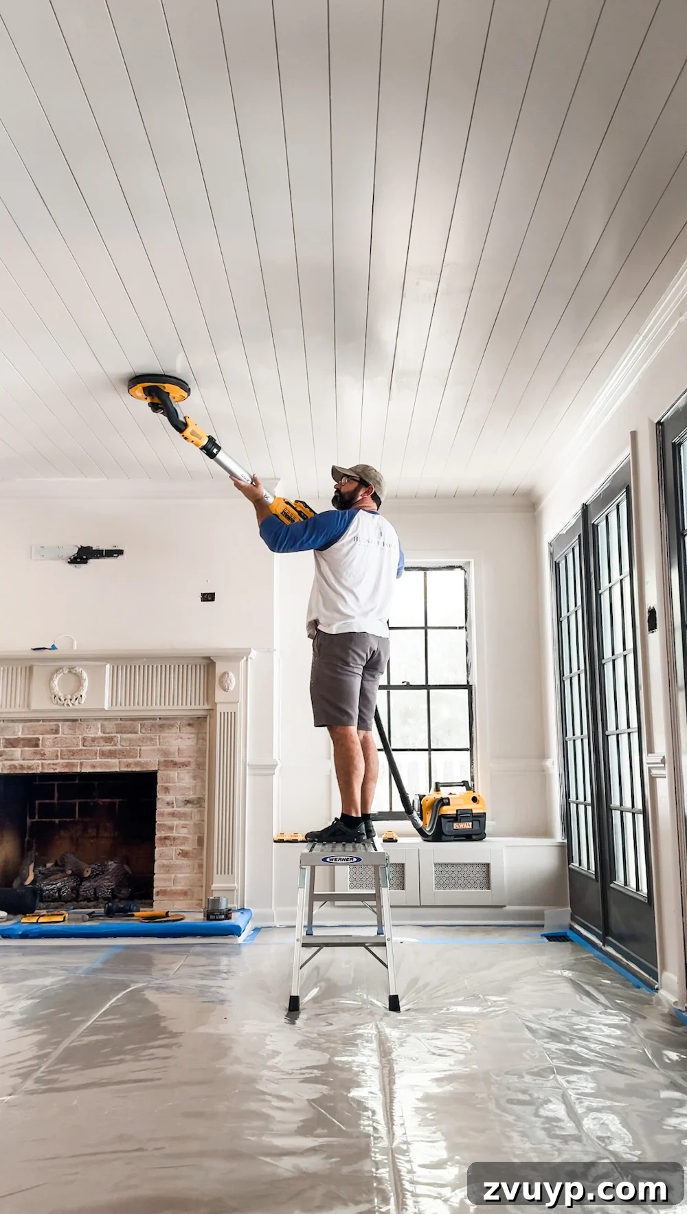 Transform Your Ceiling: Shiplap and Crown Molding Project 11 DIY shiplap ceiling sanding process