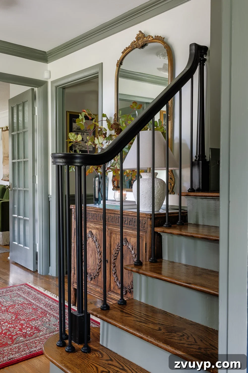 100+ Speedy Home Upgrades for Your Long Weekend Refresh 7 Stylish modern traditional foyer with painted stair risers and decorative elements