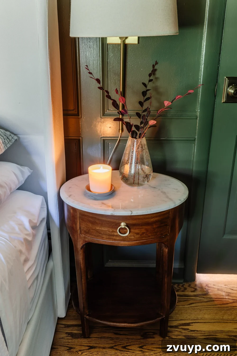 Clever Nightstands: Elevating Tiny Bedrooms with Smart Designs 4 Close-up of a stylish slim nightstand with a lamp and book
