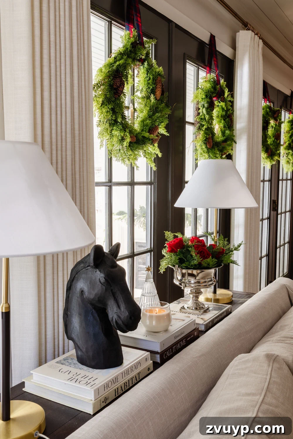 Achieving Ralph Lauren Christmas Elegance on a Dime 11 Ralph Lauren Christmas decorating ideas on a budget - horse statue on a side table with holiday decor