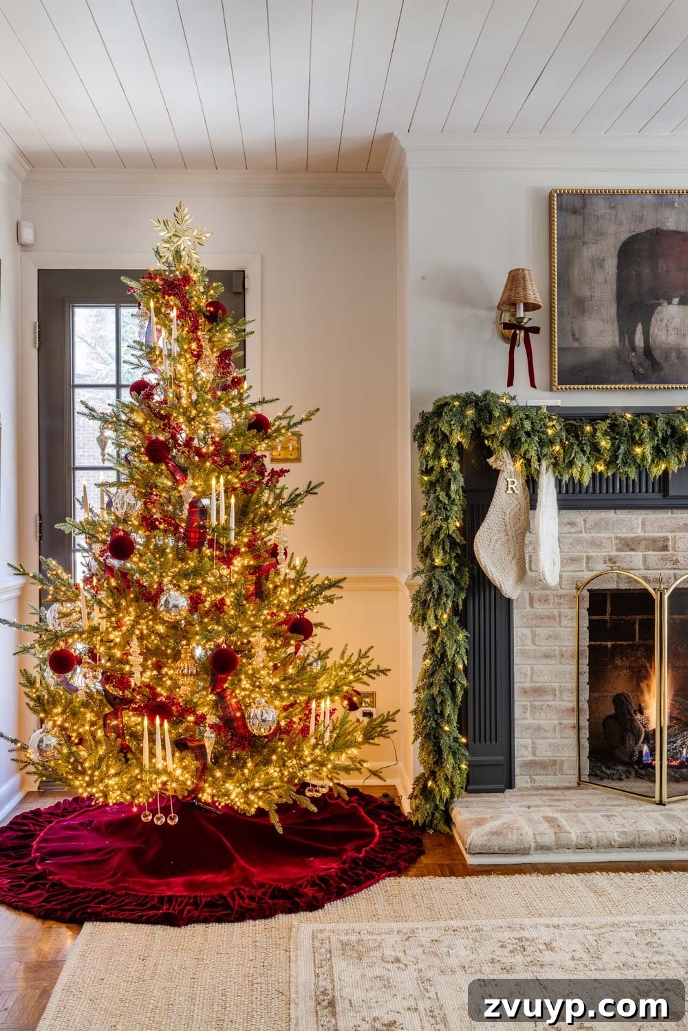 Achieving Ralph Lauren Christmas Elegance on a Dime 16 Ralph Lauren Christmas decorating ideas on a budget - cozy living room decorated for Christmas with a large tree and traditional accents