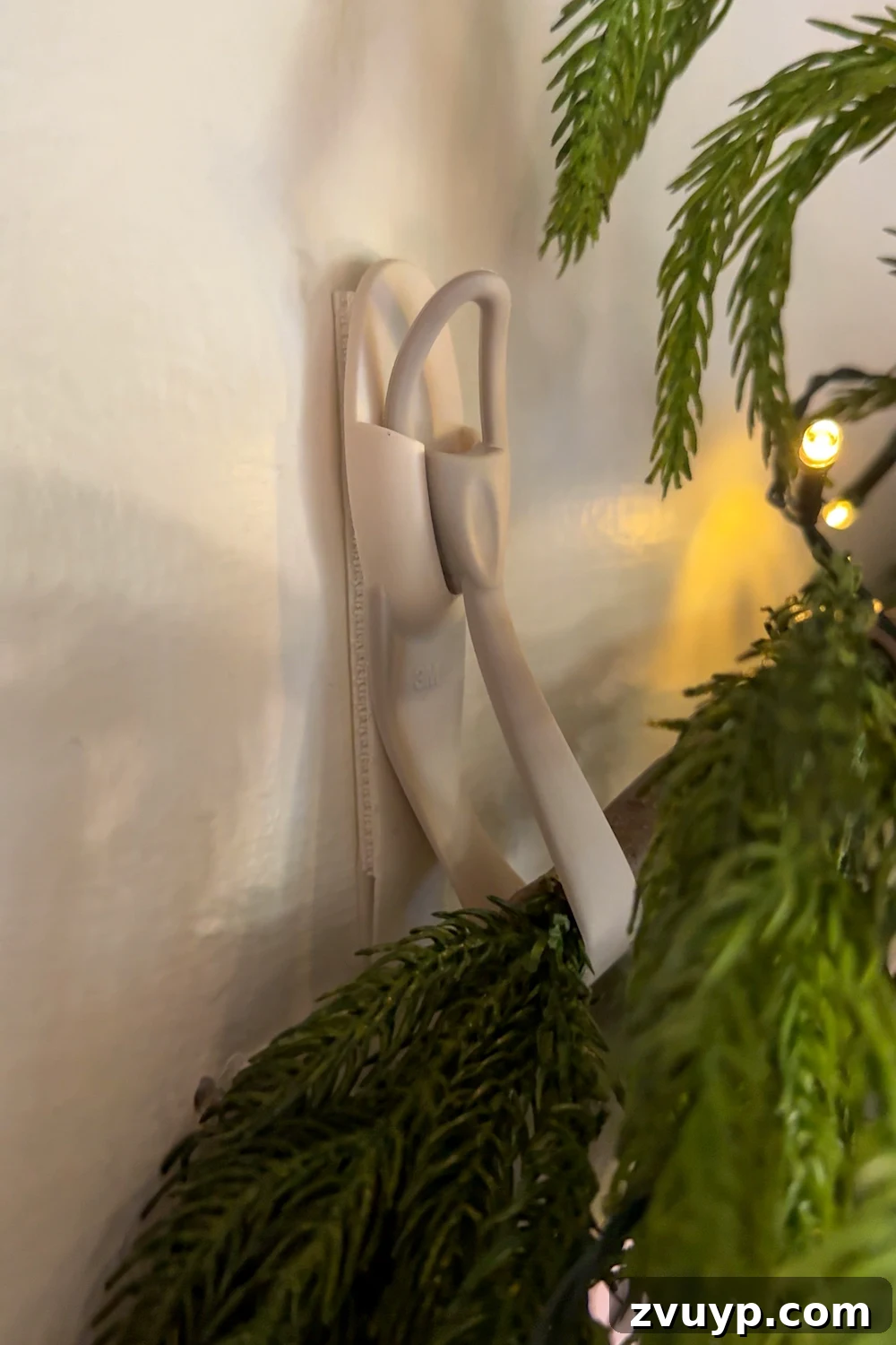 Hang Garland Over Any Doorway Damage-Free and Custom 7 how to hang doorway garland inside with no damage for Christmas