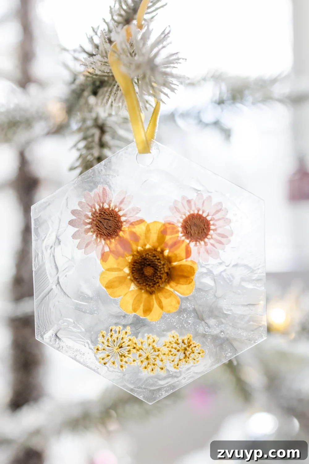 Surprisingly Simple Pressed Flower Ornaments 10 A close-up of a whimsical DIY pressed flower ornament designed to look like Mickey Mouse, with colorful flowers arranged on a clear acrylic tag, adding a playful touch to Christmas decor.