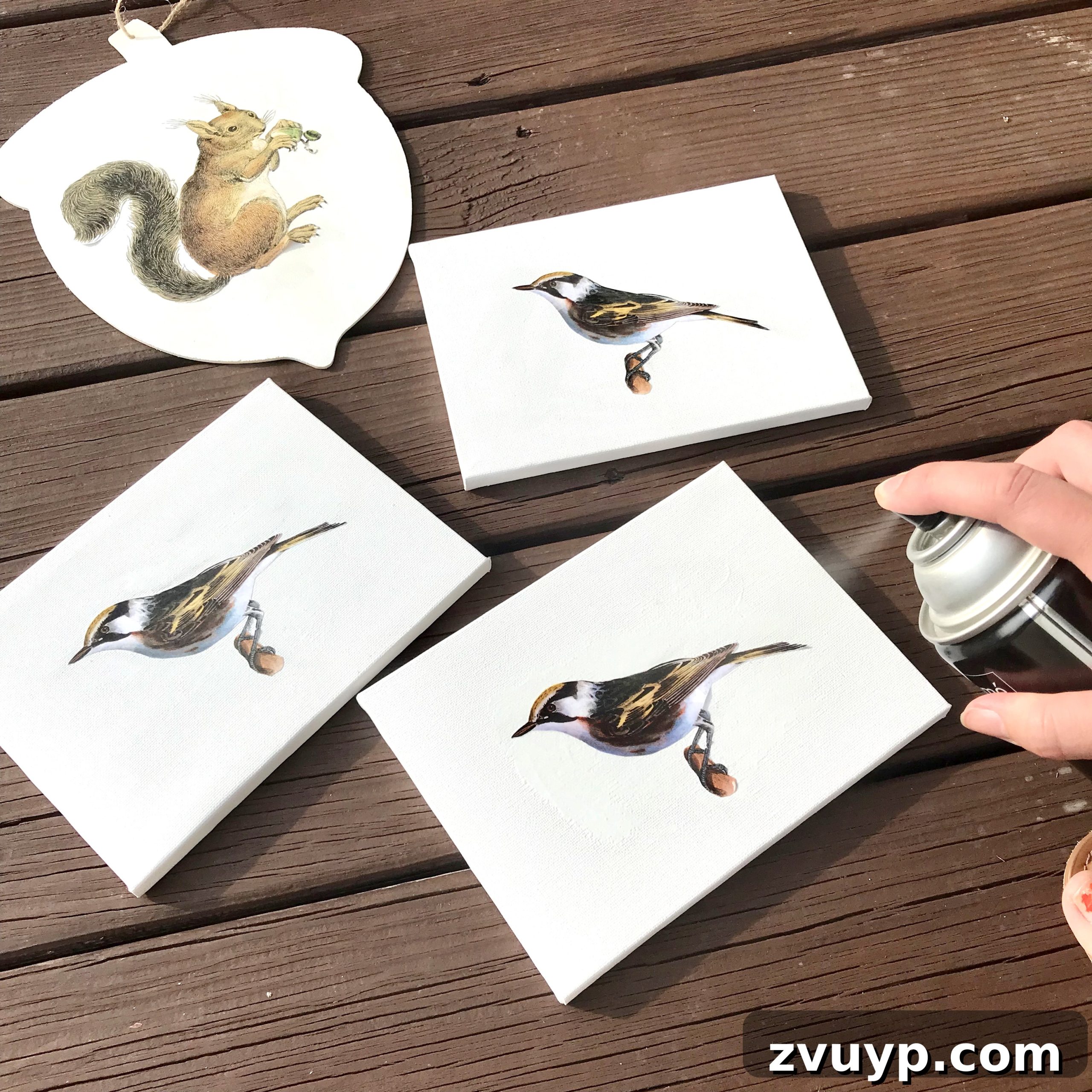The Ultimate Guide to Decoupage Glue 12 Applying hairspray to seal inkjet images before decoupaging