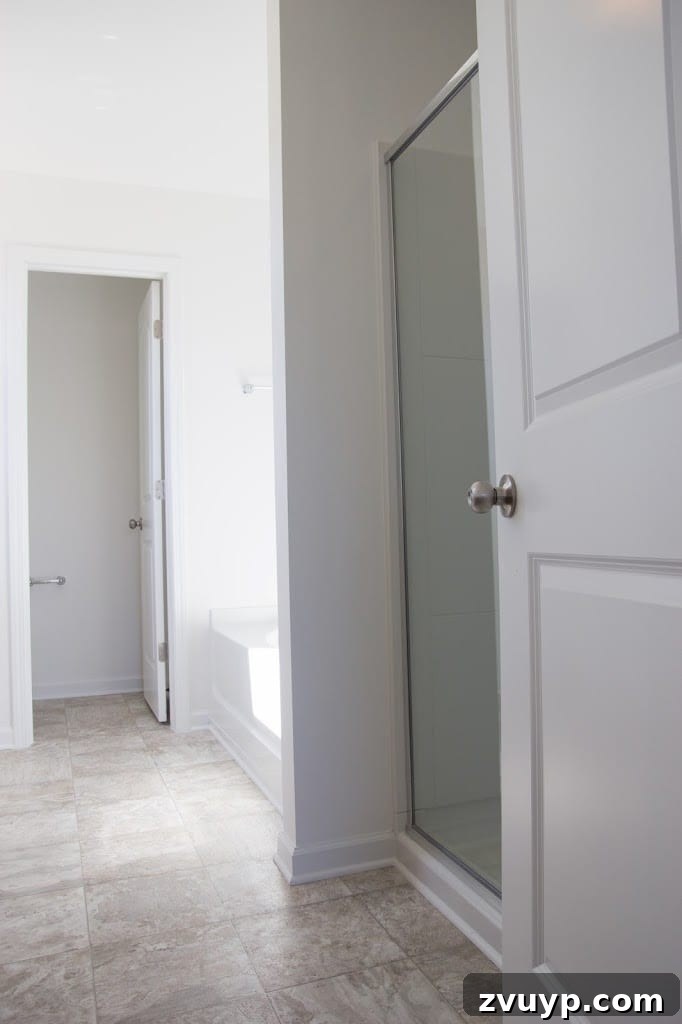 Before: Bland Builder-Grade Bathroom with White Walls and Basic Fixtures