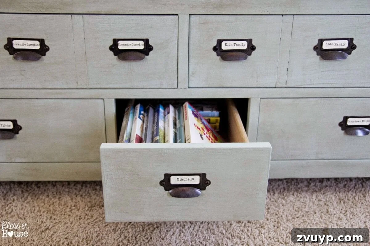 Interior view of the Faux Planked Card Catalog Coffee Table, showing DVDs neatly stored inside its compartments.