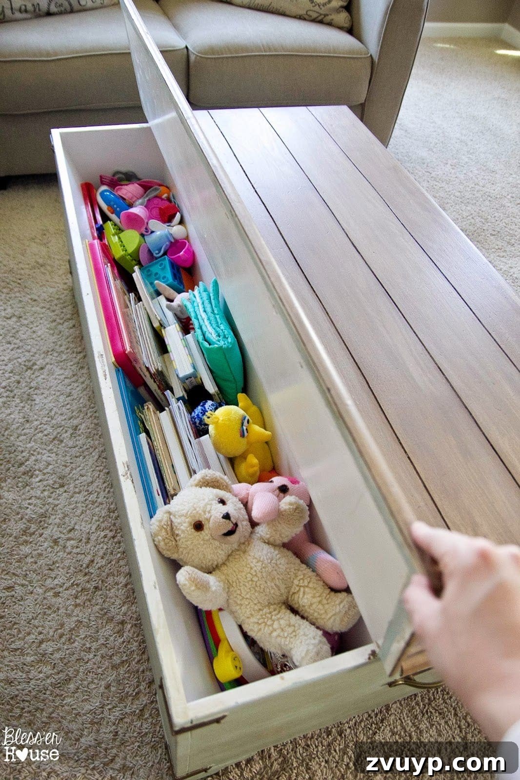Faux Planked Card Catalog Coffee Table with the lid open, revealing generous storage space for toys.