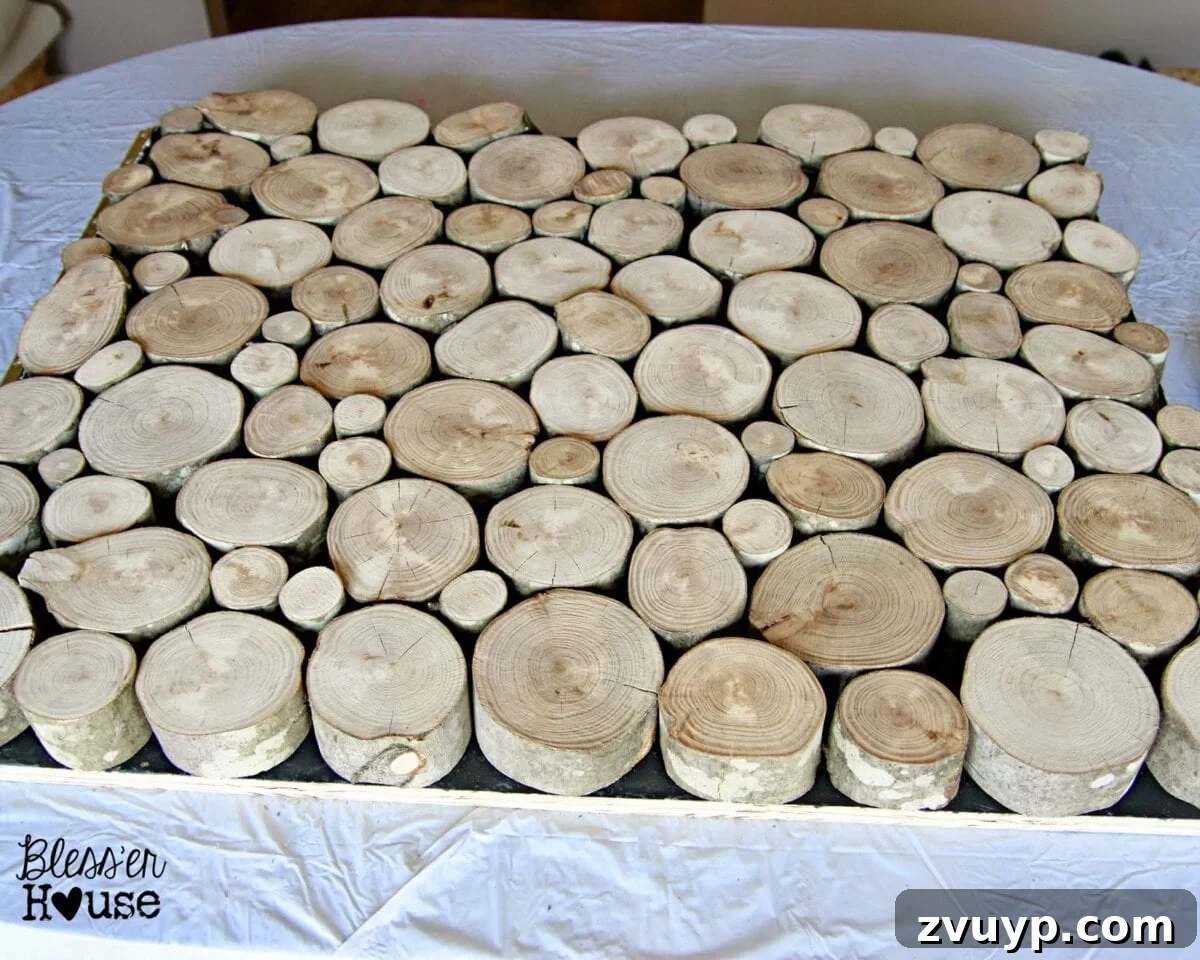 Arranging faux wood stack for fireplace door