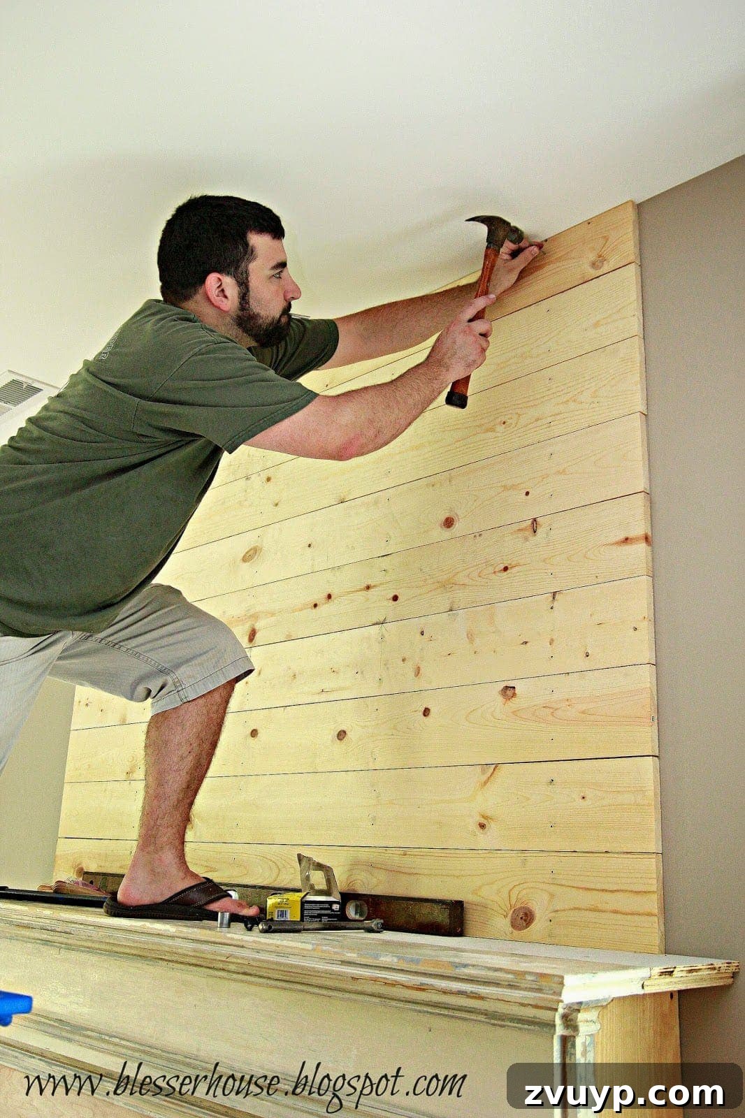 Trimming the last plank to fit near the ceiling