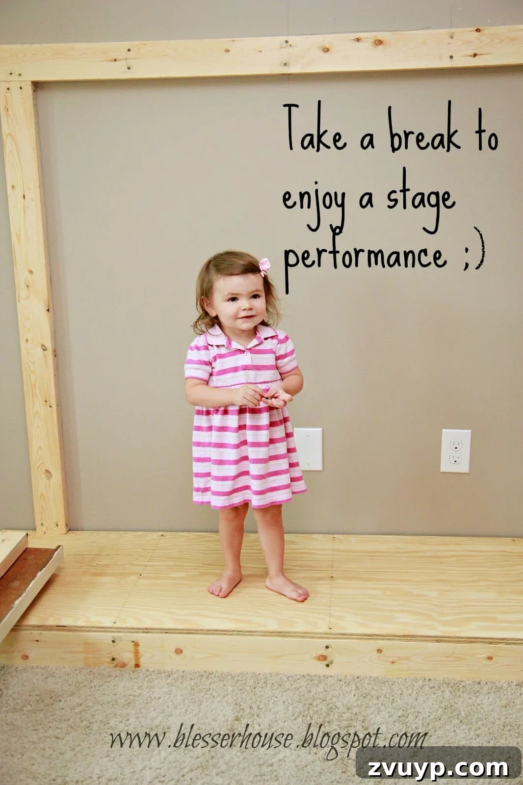 Toddler playing on faux fireplace hearth