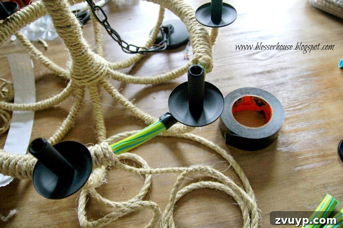 Securing the wrapped hula hoop inside the chandelier