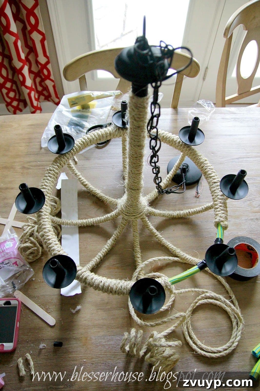 Rope-wrapped chandelier with integrated hula hoop