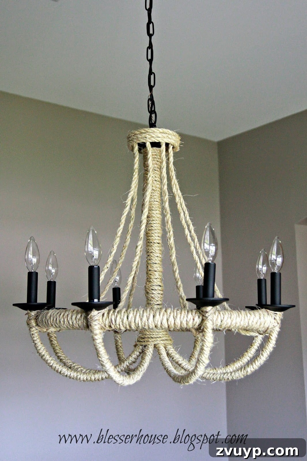 Newly installed DIY rope chandelier in a dining room