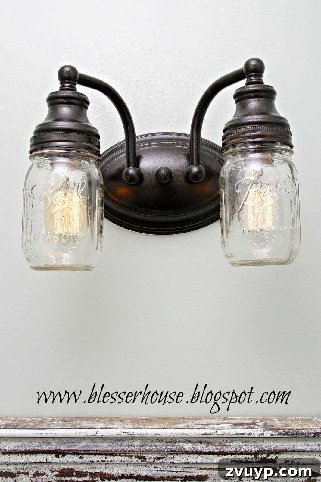 Close-up of the newly transformed farmhouse mason jar bathroom vanity light